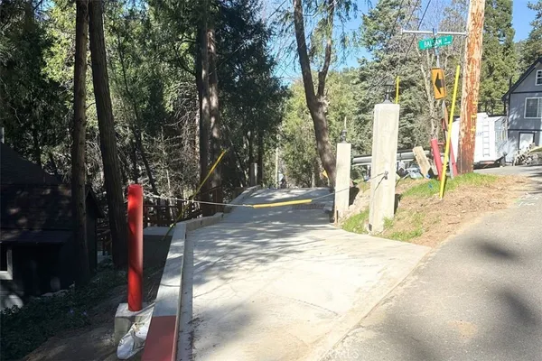 a view of street with large trees