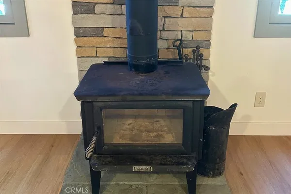 a view of fireplace and wooden floor
