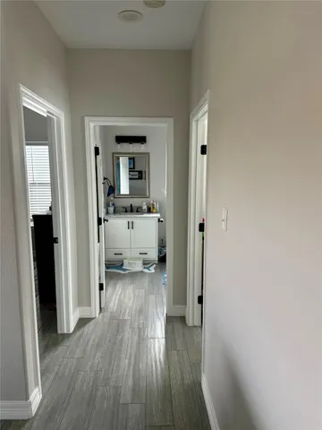 a view of a bedroom from a hallway