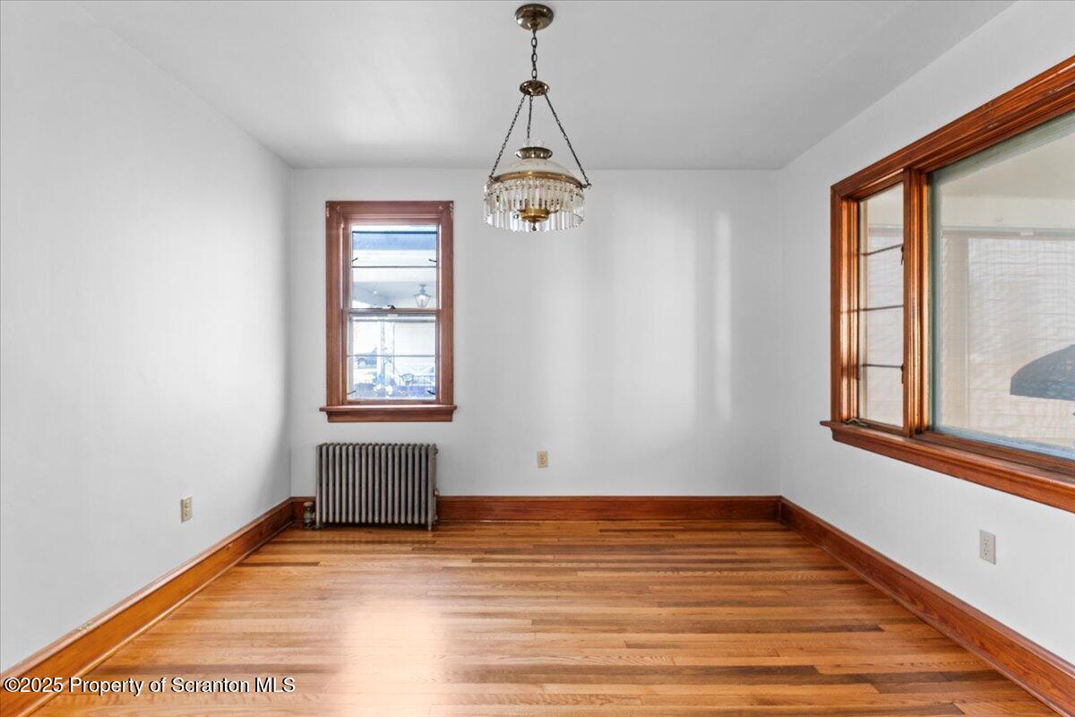 131 Stephenson Street Duryea, PA 18642 - Photo 11 of 28 a view of an empty room with wooden floor and a window