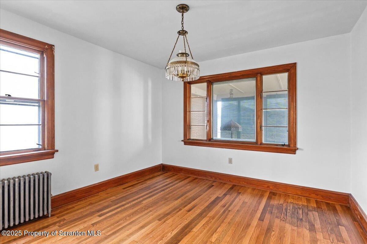 131 Stephenson Street Duryea, PA 18642 - Photo 12 of 28 a view of an empty room with wooden floor and a window
