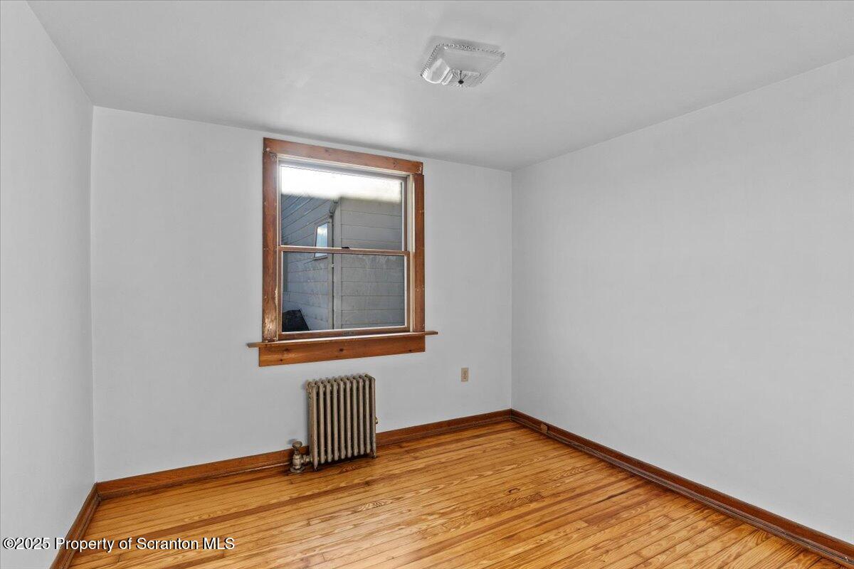 131 Stephenson Street Duryea, PA 18642 - Photo 18 of 28 a view of a room with wooden floor and a window