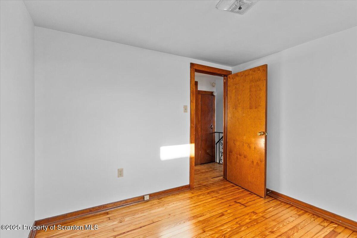 131 Stephenson Street Duryea, PA 18642 - Photo 19 of 28 a view of an empty room with closet and a window