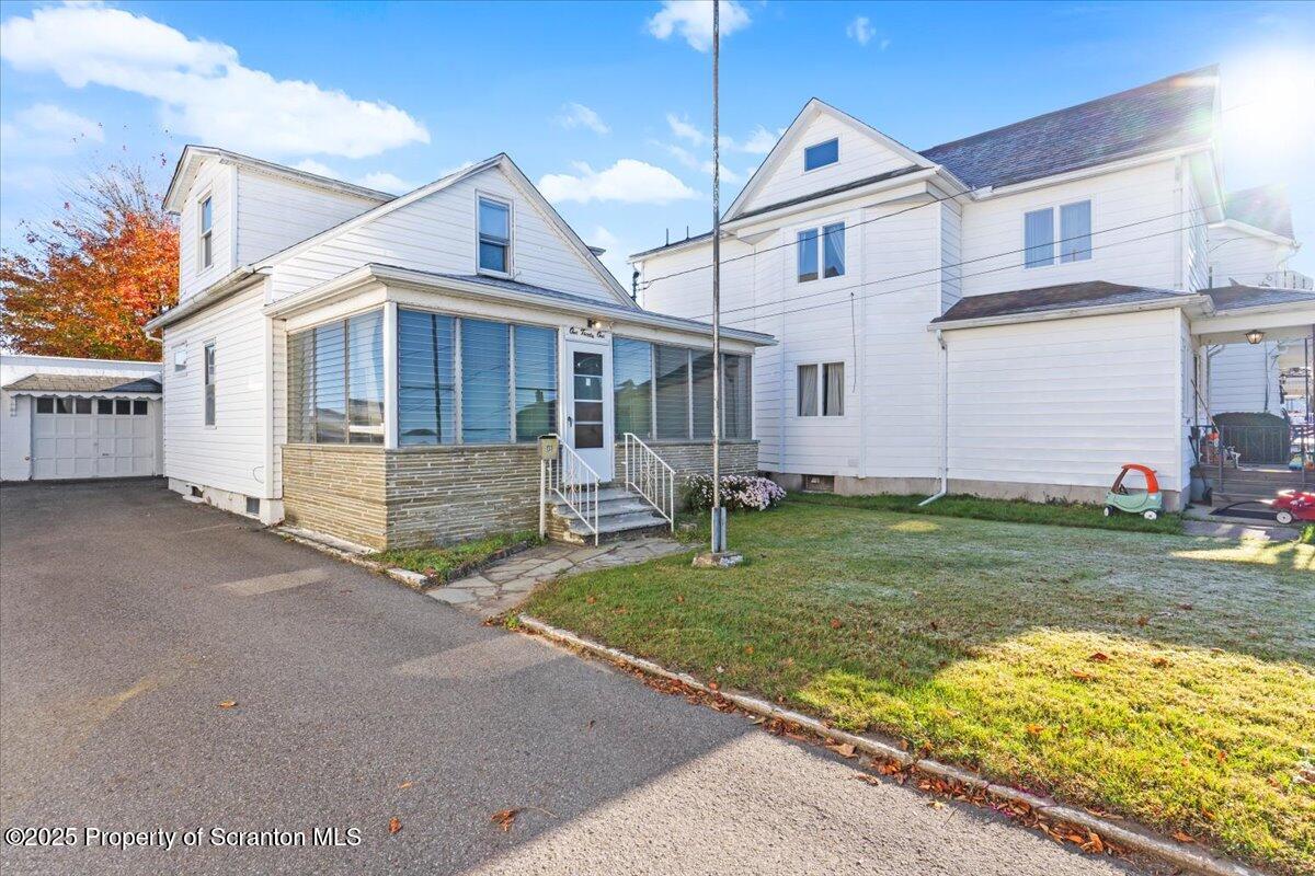 131 Stephenson Street Duryea, PA 18642 - Photo 2 of 28 a front view of house with yard