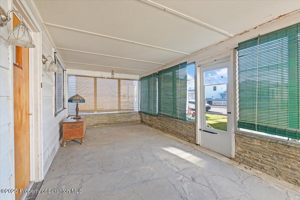 131 Stephenson Street Duryea, PA 18642 - Photo 23 of 28 a view of an empty room with wooden floor and a window