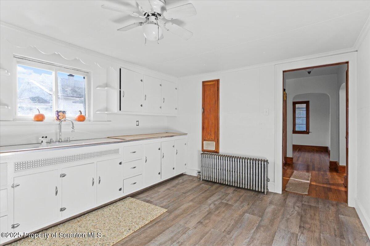 131 Stephenson Street Duryea, PA 18642 - Photo 3 of 28 a en suite bathroom with a sink a mirror and a bathtub