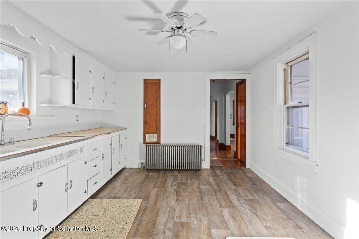 131 Stephenson Street Duryea, PA 18642 - Photo 5 of 28 a spacious en suite bathroom with a double vanity sink a mirror and a bathtub