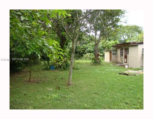 5942 Southwest 60th Street Miami, FL 33143 - Photo 10 of 14 a view of a house with a backyard