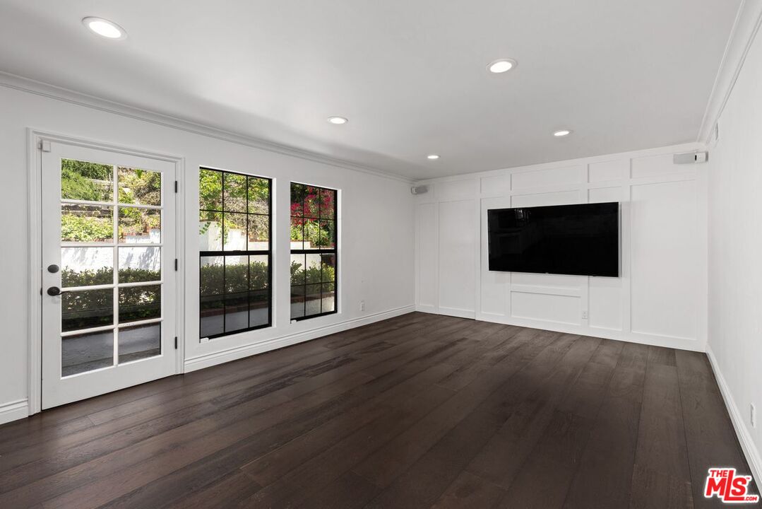 1060 Chantilly Road Los Angeles, CA 90077 - Photo 14 of 40 a view of wooden floor wooden cabinets and windows