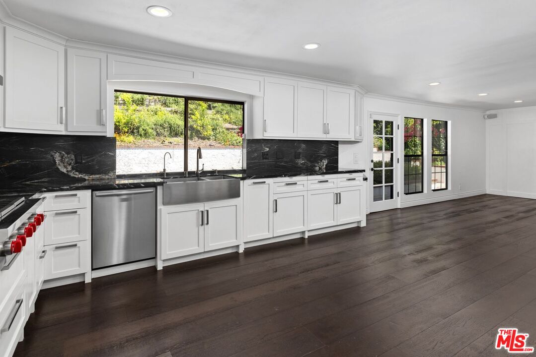 1060 Chantilly Road Los Angeles, CA 90077 - Photo 19 of 40 a kitchen with a sink a window and appliances