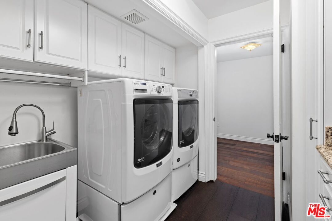 1060 Chantilly Road Los Angeles, CA 90077 - Photo 23 of 40 a utility room with cabinets
