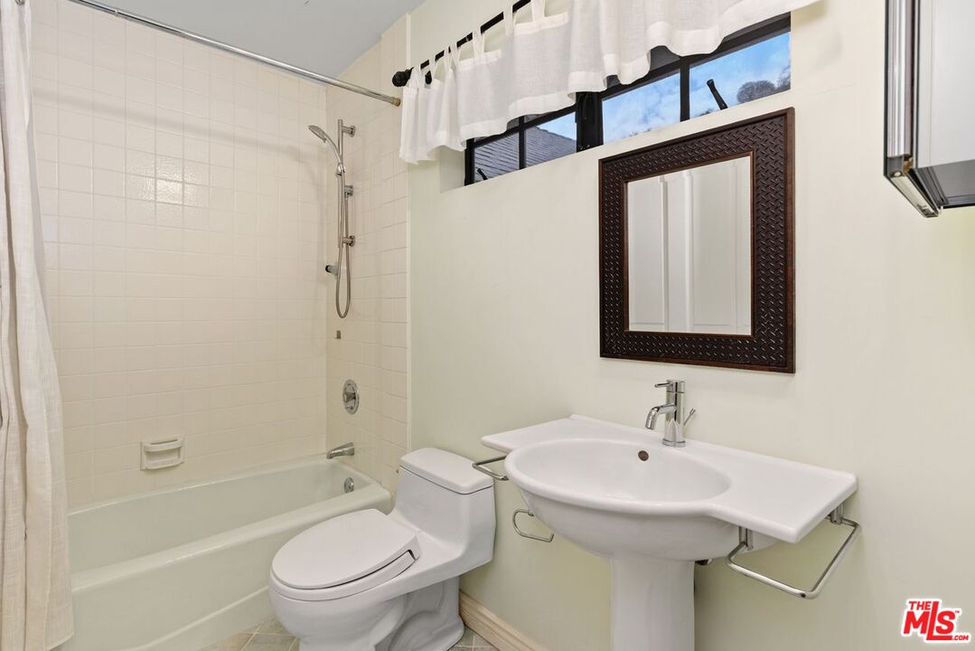 1060 Chantilly Road Los Angeles, CA 90077 - Photo 35 of 40 a bathroom with a sink toilet and shower