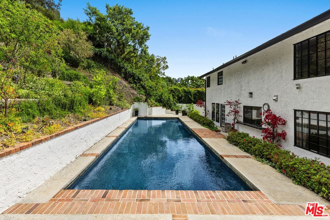 1060 Chantilly Road Los Angeles, CA 90077 - Photo 37 of 40 a view of swimming pool with a patio
