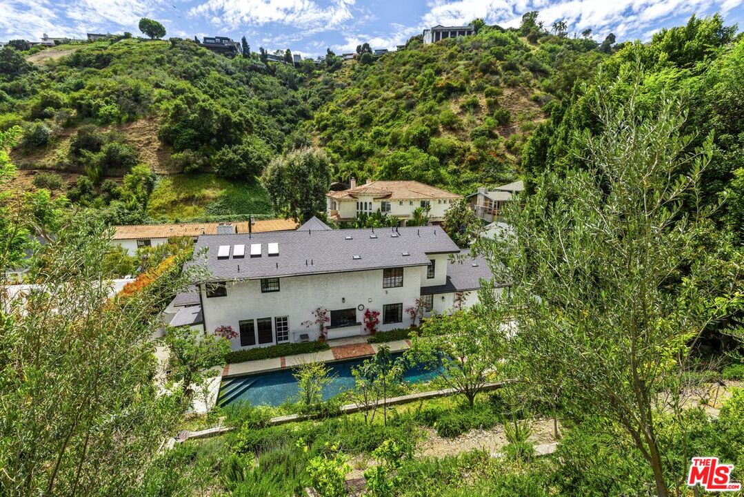 1060 Chantilly Road Los Angeles, CA 90077 - Photo 39 of 40 an aerial view of a house with swimming pool and garden