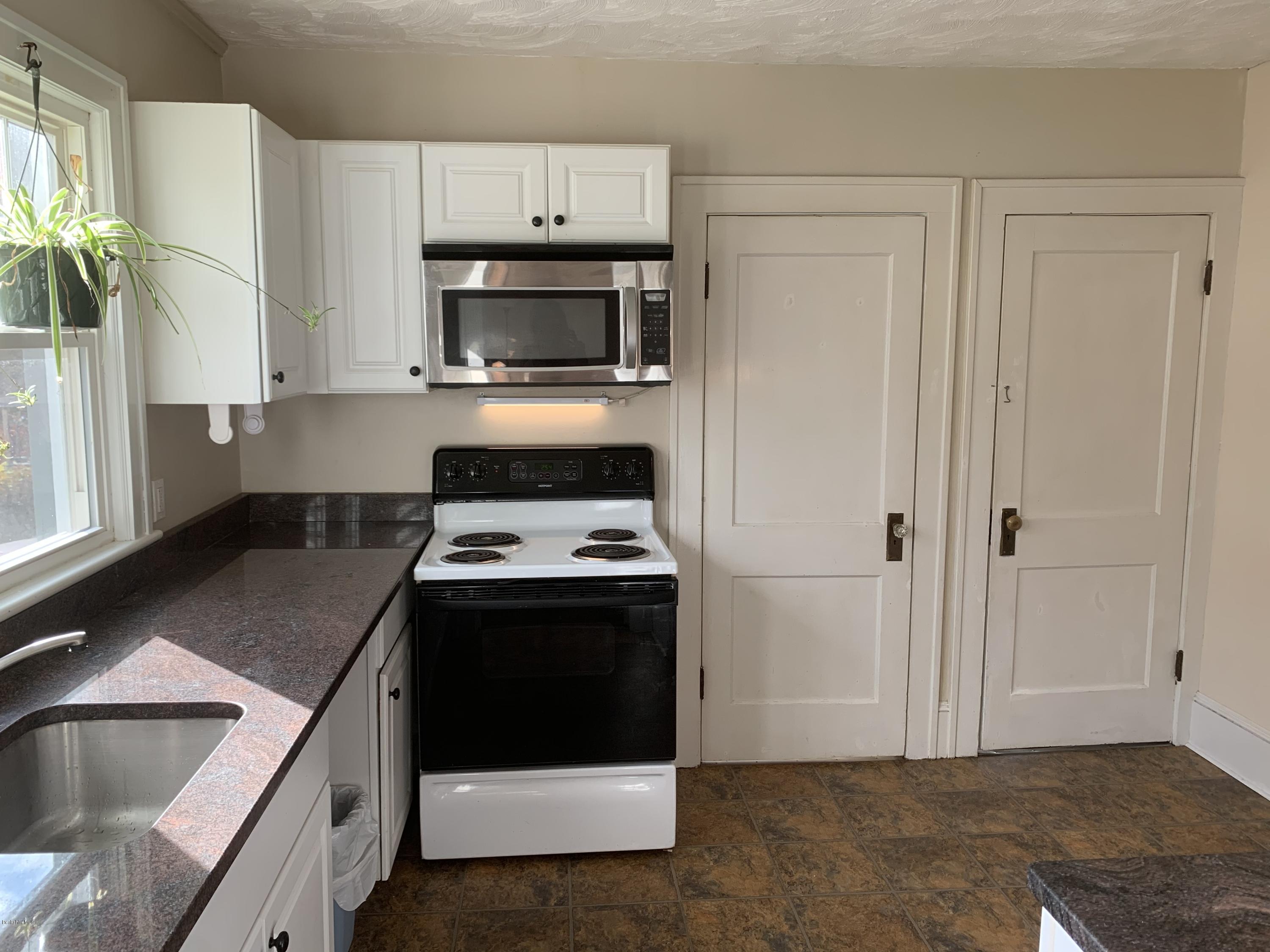 163 Cheshire Road Pittsfield, MA 01201 - Photo 22 of 45 Kitchen to basement and yard