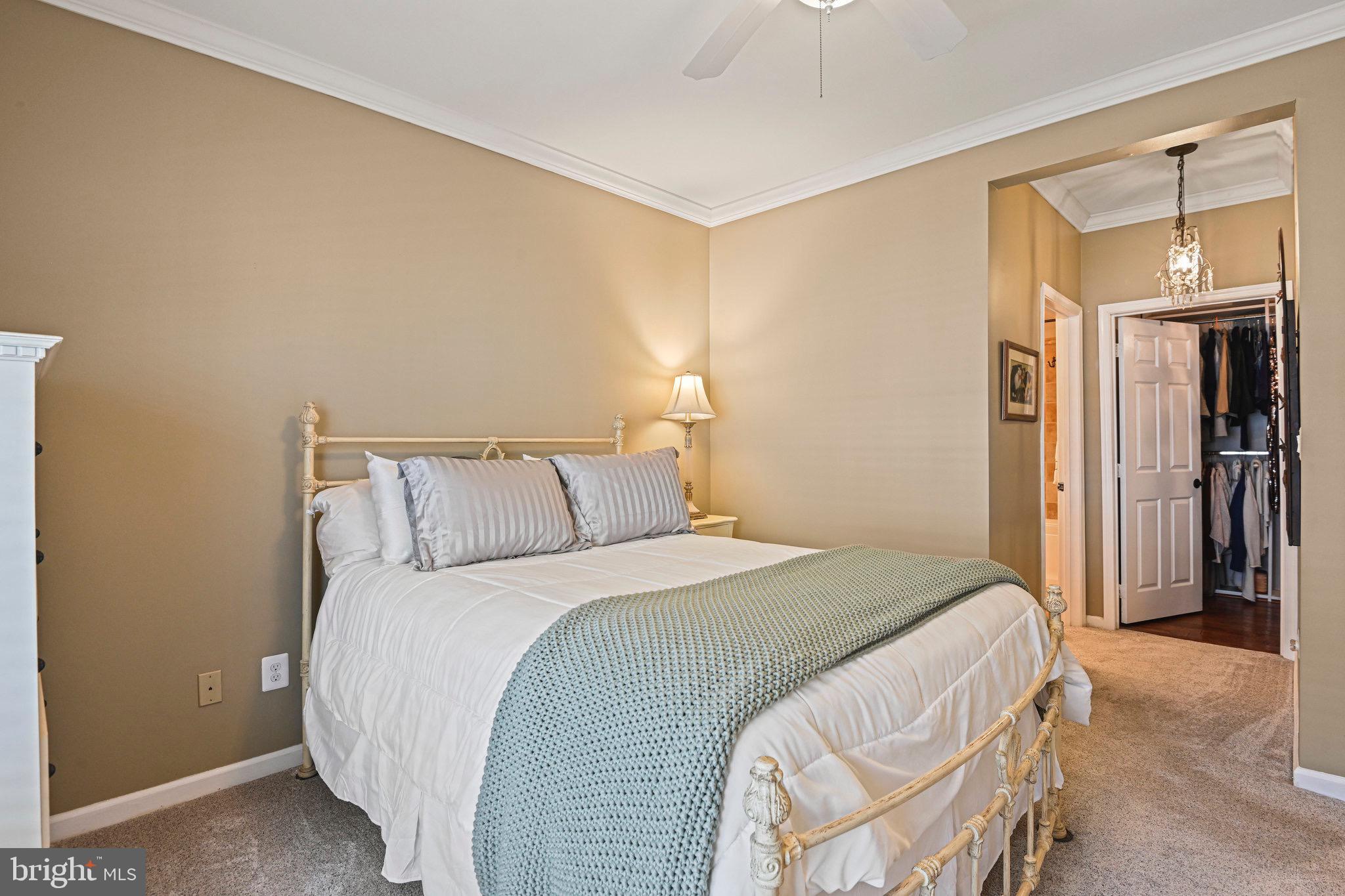 1701 Lake Shore Crest Drive, Unit 24 Reston, VA 20190 - Photo 15 of 43 a bedroom with a bed and a mirror