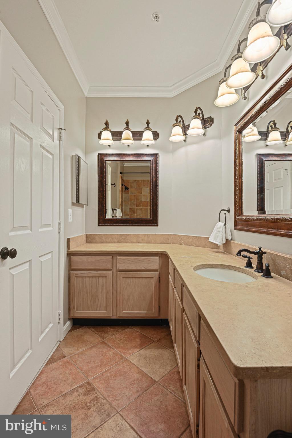 1701 Lake Shore Crest Drive, Unit 24 Reston, VA 20190 - Photo 19 of 43 a kitchen with sink cabinets and stove
