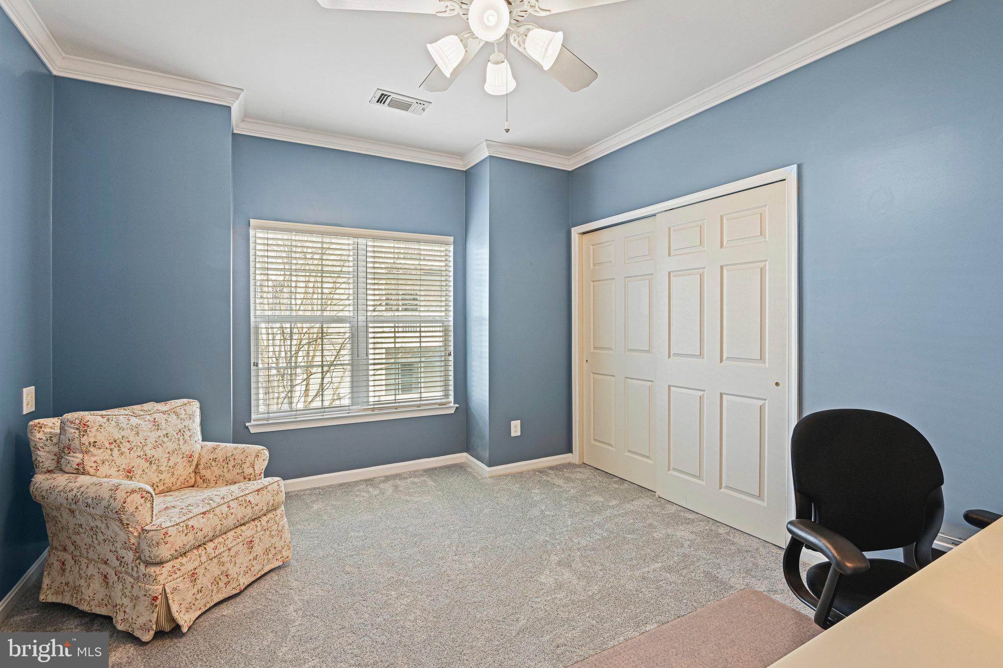 1701 Lake Shore Crest Drive, Unit 24 Reston, VA 20190 - Photo 21 of 43 a living room with furniture and a window