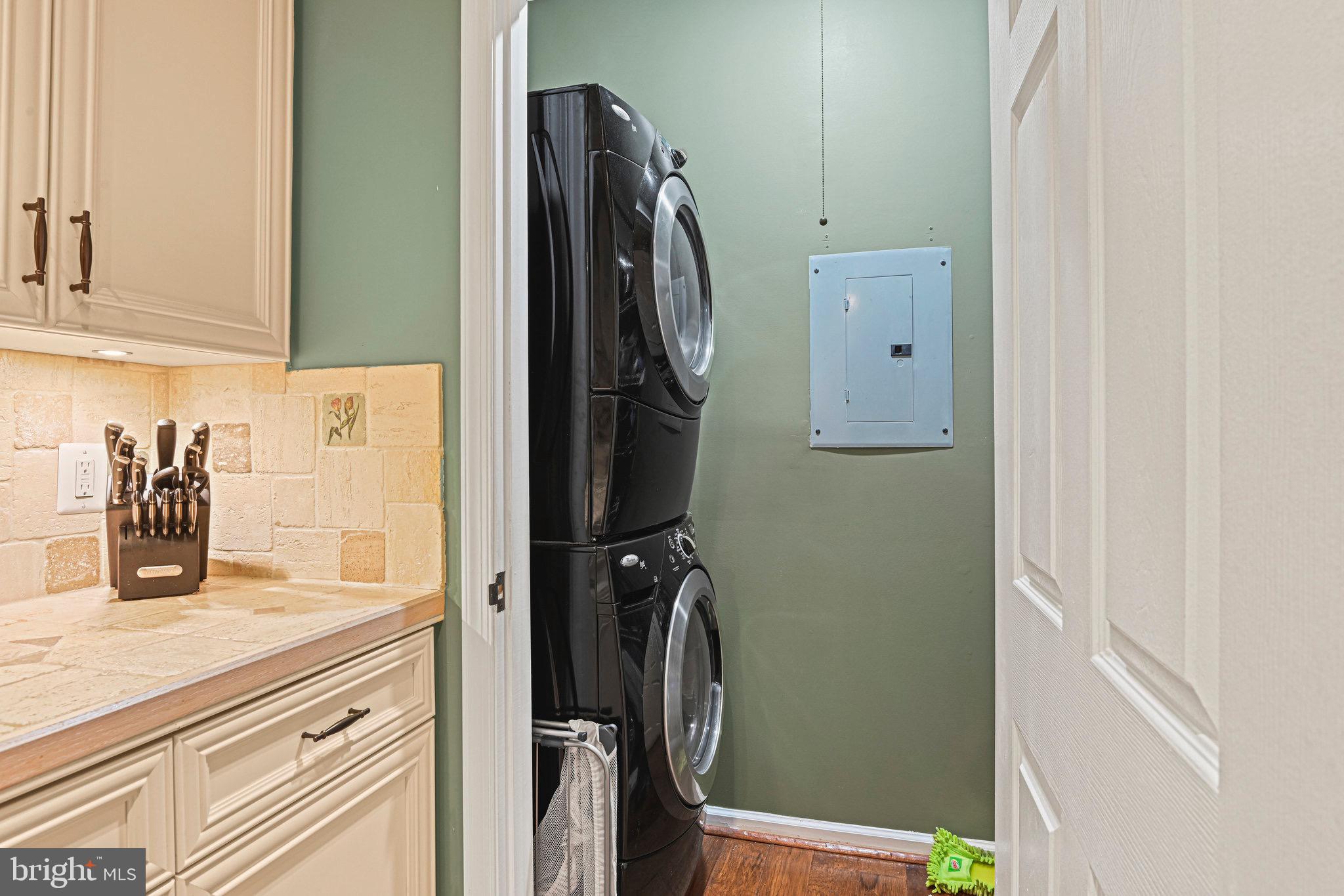 1701 Lake Shore Crest Drive, Unit 24 Reston, VA 20190 - Photo 24 of 33 a bathroom with a granite countertop shower and a sink