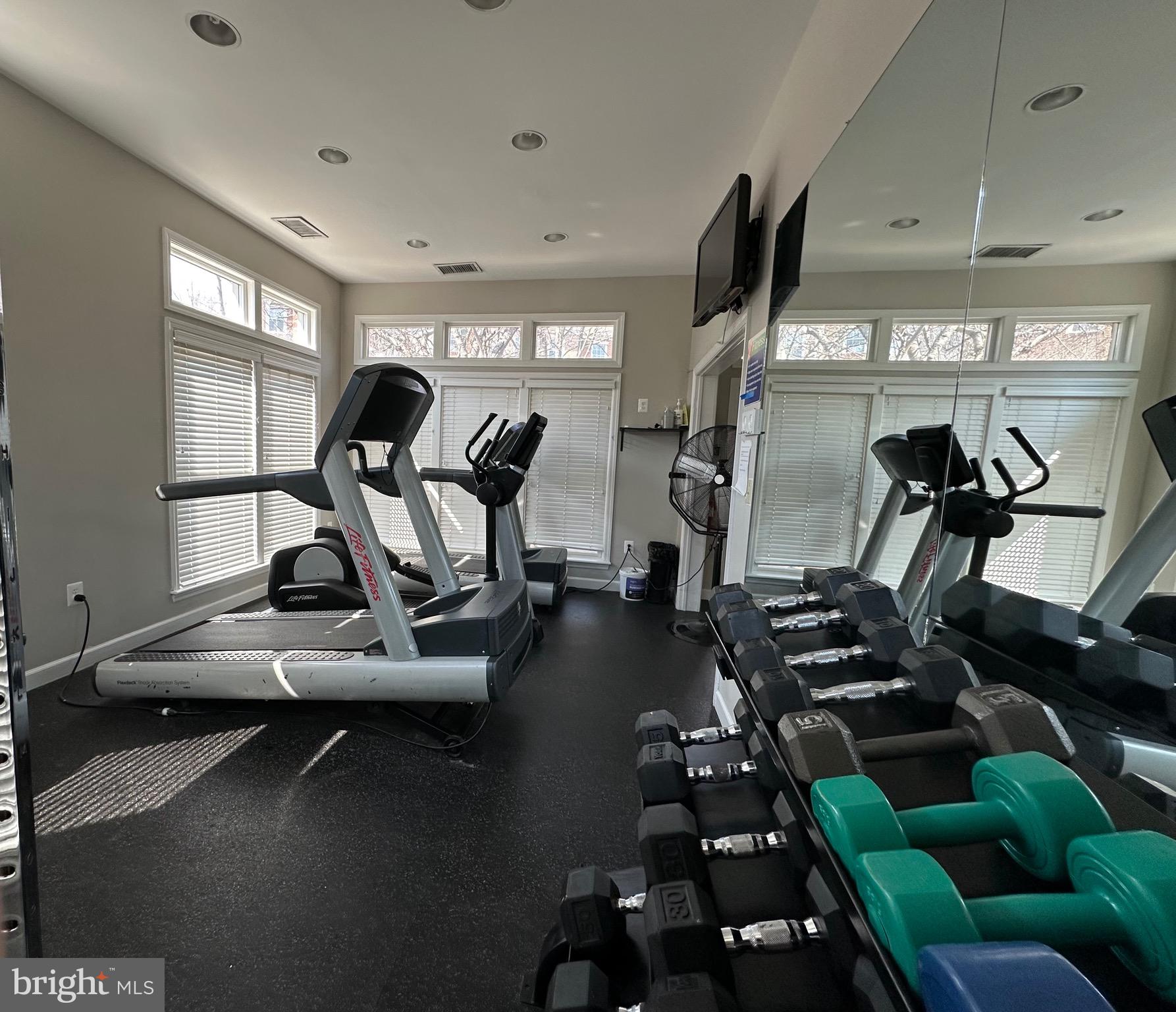 1701 Lake Shore Crest Drive, Unit 24 Reston, VA 20190 - Photo 27 of 33 a view of a room with gym equipment