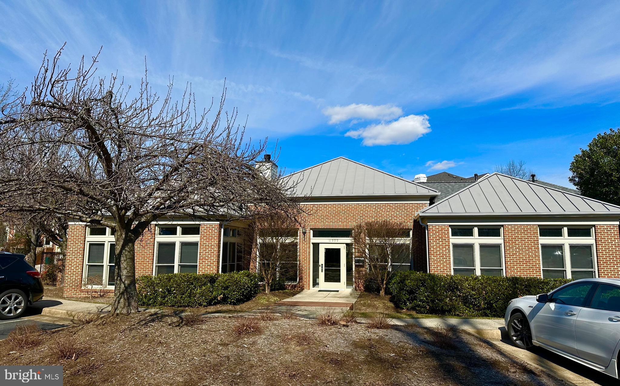 1701 Lake Shore Crest Drive, Unit 24 Reston, VA 20190 - Photo 30 of 43 a front view of a house with a yard