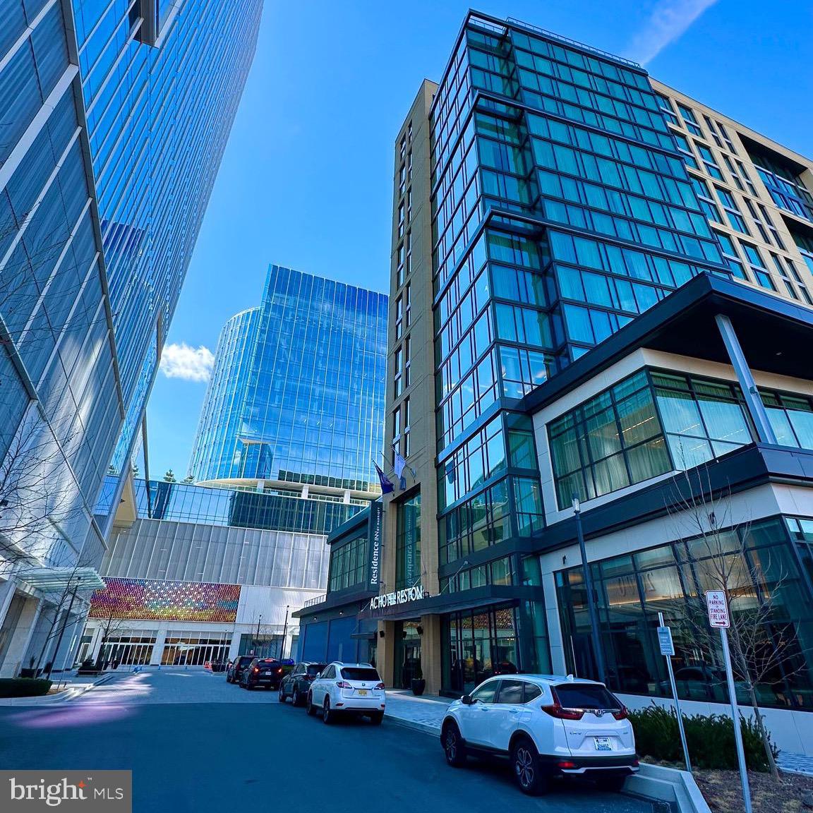 1701 Lake Shore Crest Drive, Unit 24 Reston, VA 20190 - Photo 42 of 43 a car parked in front of a building