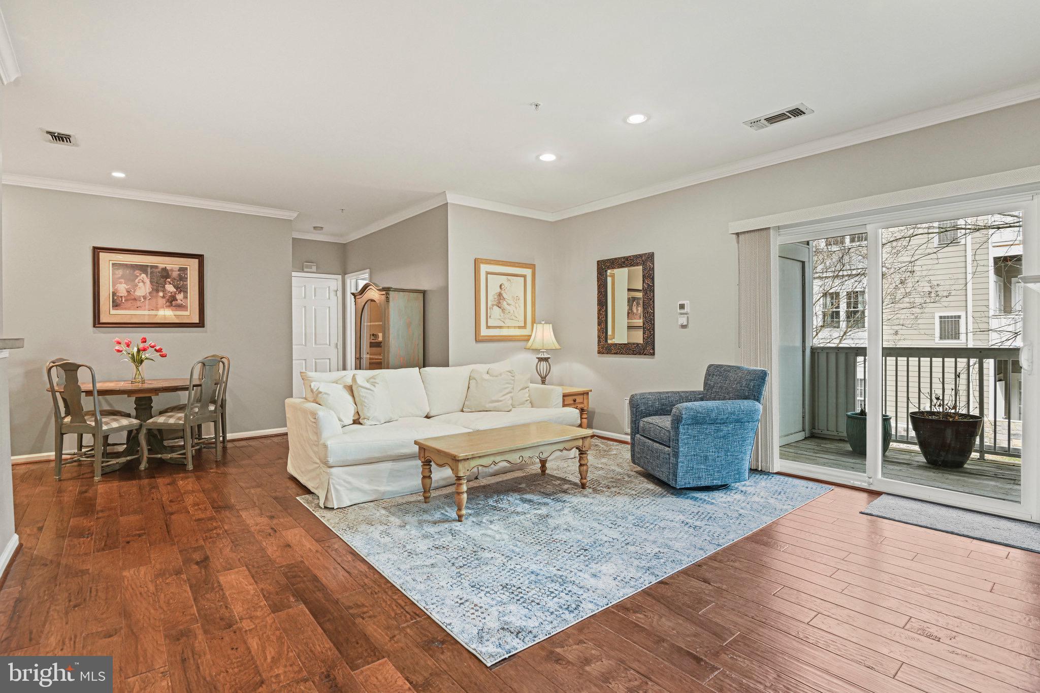 1701 Lake Shore Crest Drive, Unit 24 Reston, VA 20190 - Photo 5 of 43 a living room with furniture or couch and a wooden floor