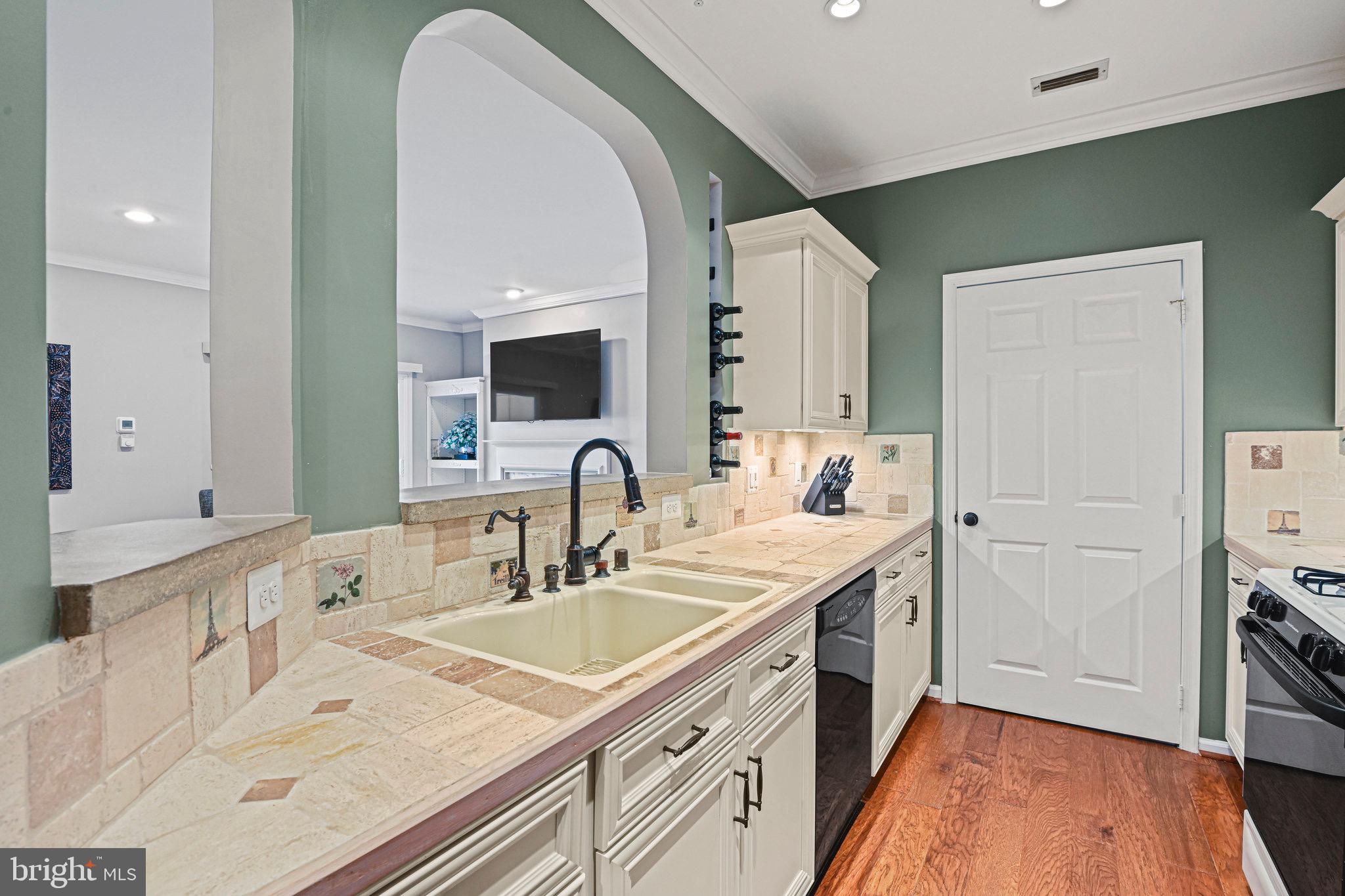 1701 Lake Shore Crest Drive, Unit 24 Reston, VA 20190 - Photo 7 of 43 a bathroom with a sink and a mirror