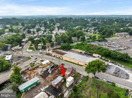 a kitchen that has a lot of cabinets and wooden floor