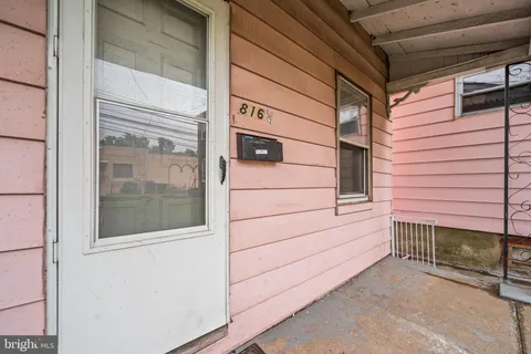 a view of front door and bedroom