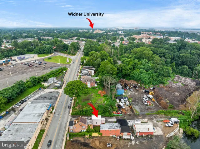 an aerial view of residential houses with outdoor space