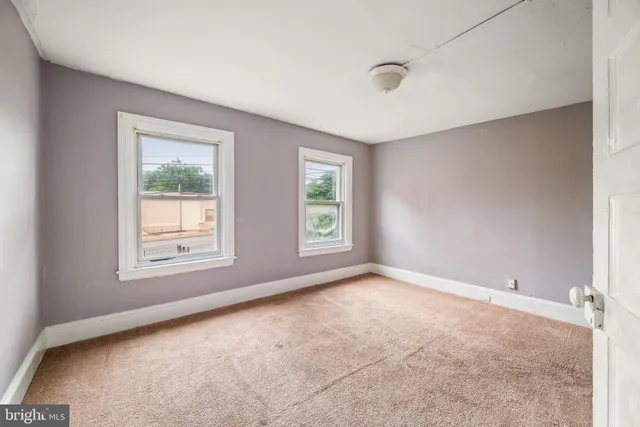 a kitchen with a refrigerator and a stove top oven