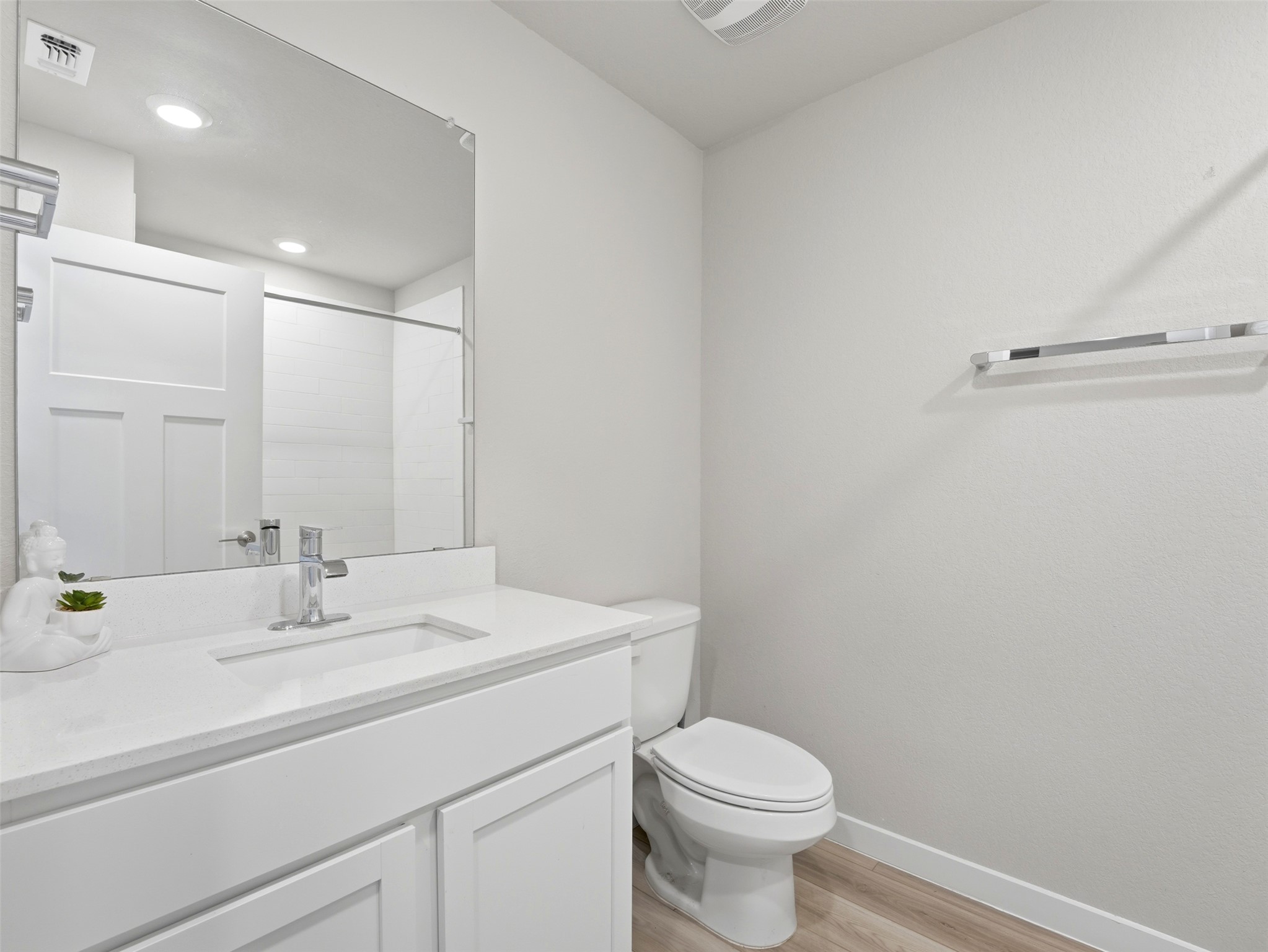 1024 Tipton Street Georgetown, TX 78633 - Photo 18 of 32 A well-appointed bathroom with contemporary fixtures and a light wood-look floor.