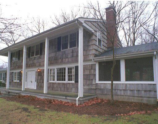 a front view of a house with a fence
