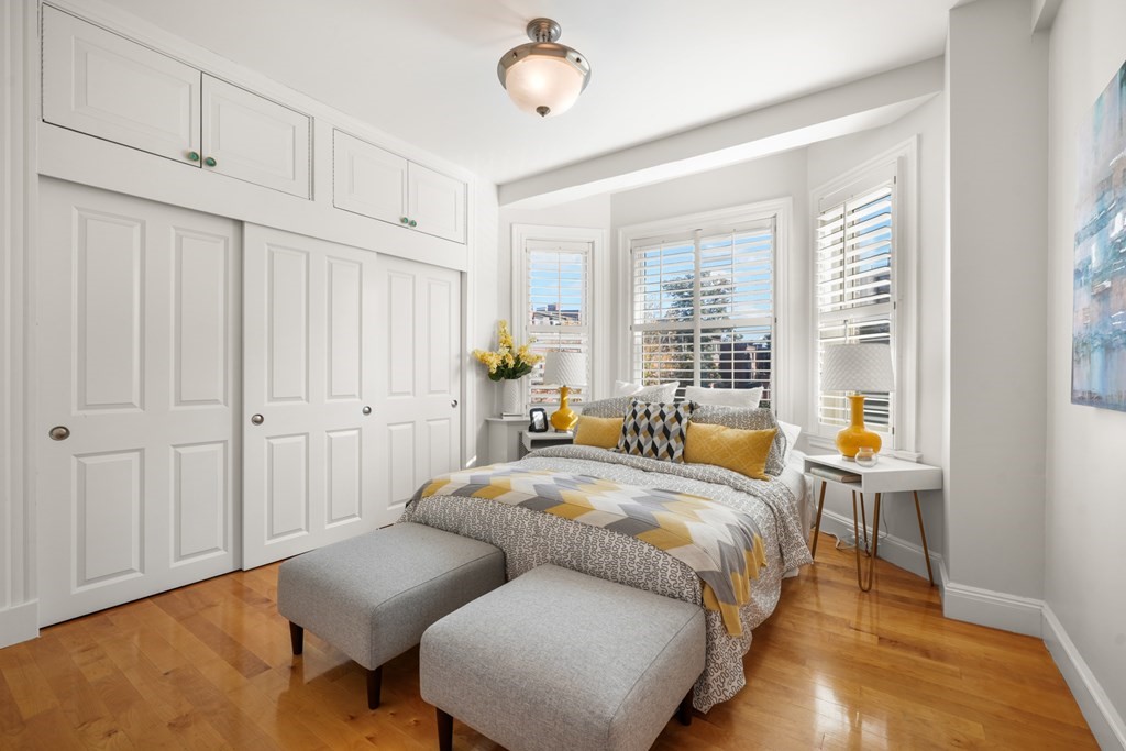 311 Commonwealth Avenue, Unit 41 Boston, MA 02115 - Photo 15 of 31 a bedroom with a bed and wooden floor