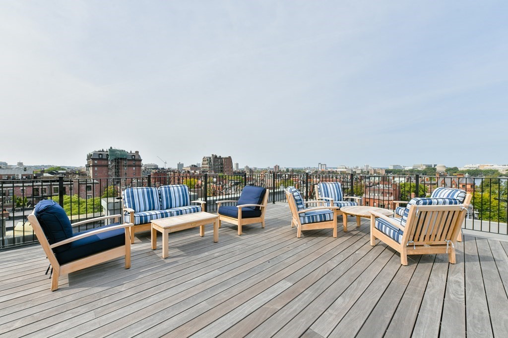 311 Commonwealth Avenue, Unit 41 Boston, MA 02115 - Photo 21 of 31 an outdoor sitting area with furniture and wooden floor