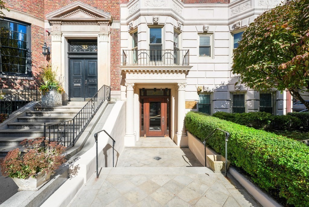 311 Commonwealth Avenue, Unit 41 Boston, MA 02115 - Photo 29 of 31 a view of a patio with couches table and chairs and potted plants