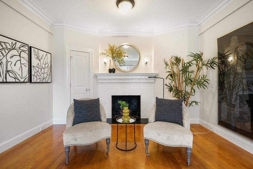 311 Commonwealth Avenue, Unit 41 Boston, MA 02115 - Photo 4 of 31 a living room with furniture and a fireplace