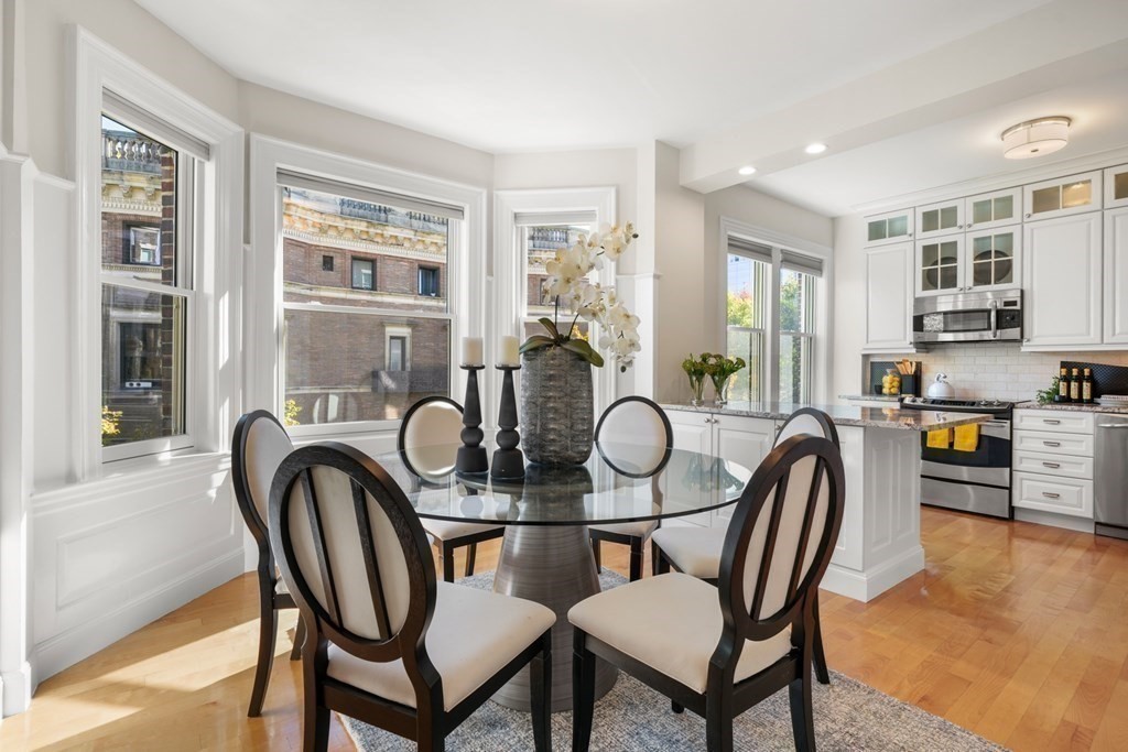 311 Commonwealth Avenue, Unit 41 Boston, MA 02115 - Photo 6 of 31 a dining room with furniture and window