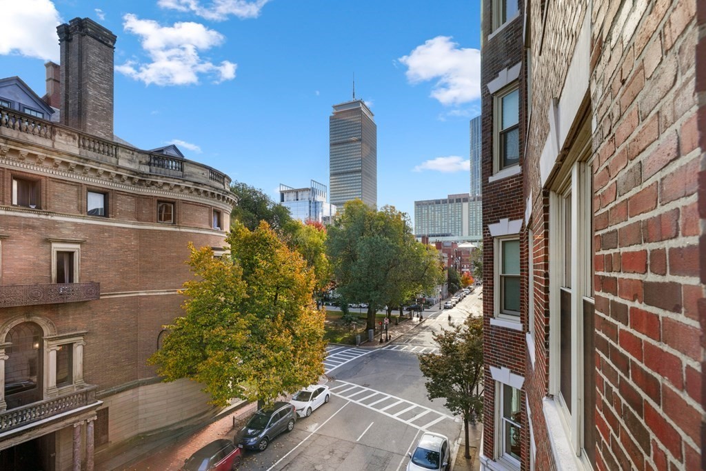 311 Commonwealth Avenue, Unit 41 Boston, MA 02115 - Photo 7 of 31 a front view of a house with a garden