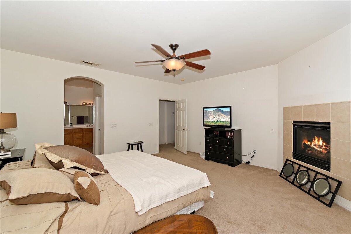 49528 Pacino Street Indio, CA 92201 - Photo 18 of 22 a bedroom with a bed and a television