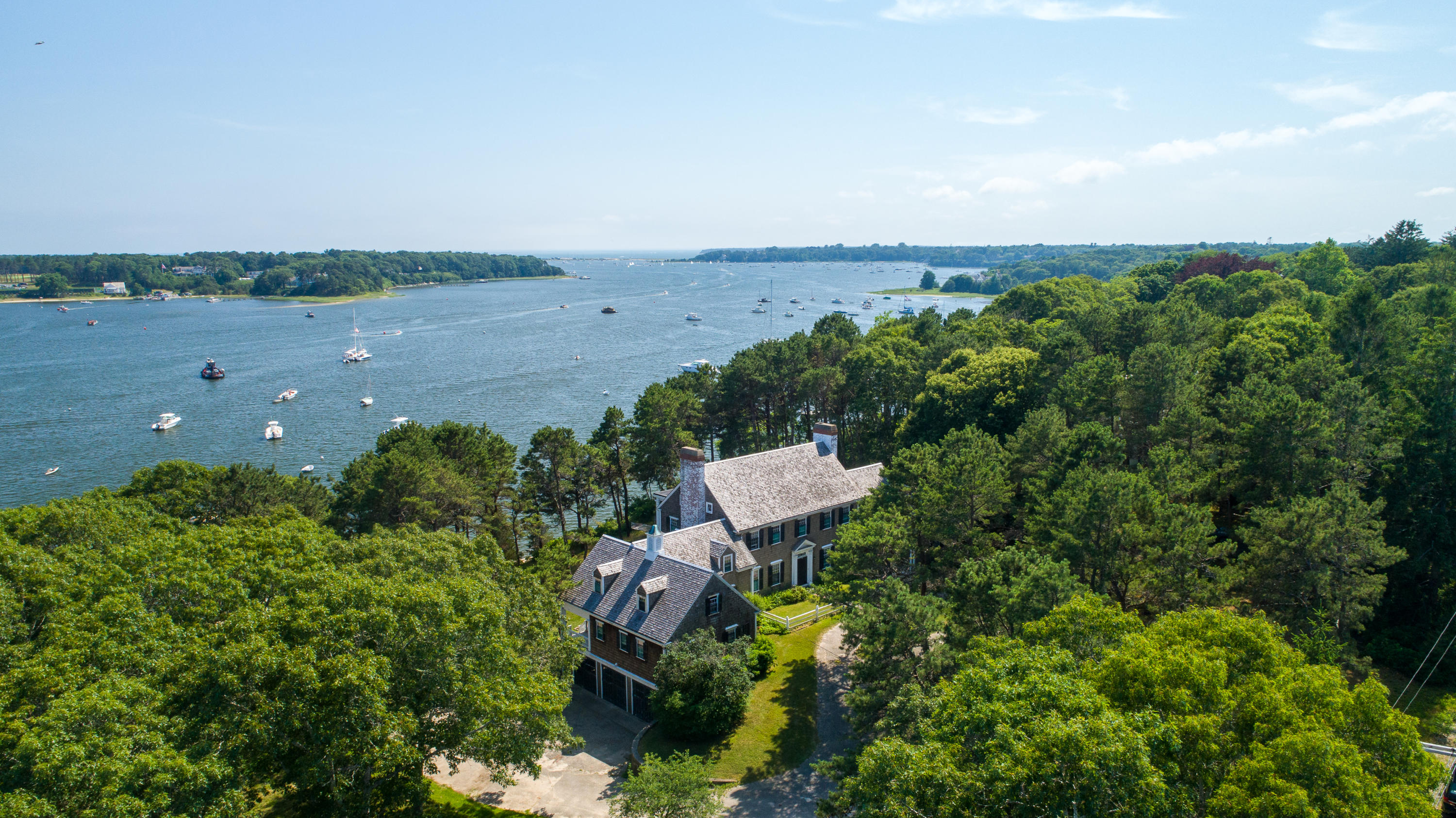 671 Old Post Road Cotuit, MA 02635 - Photo 1 of 36 an aerial view of multiple house with outdoor space