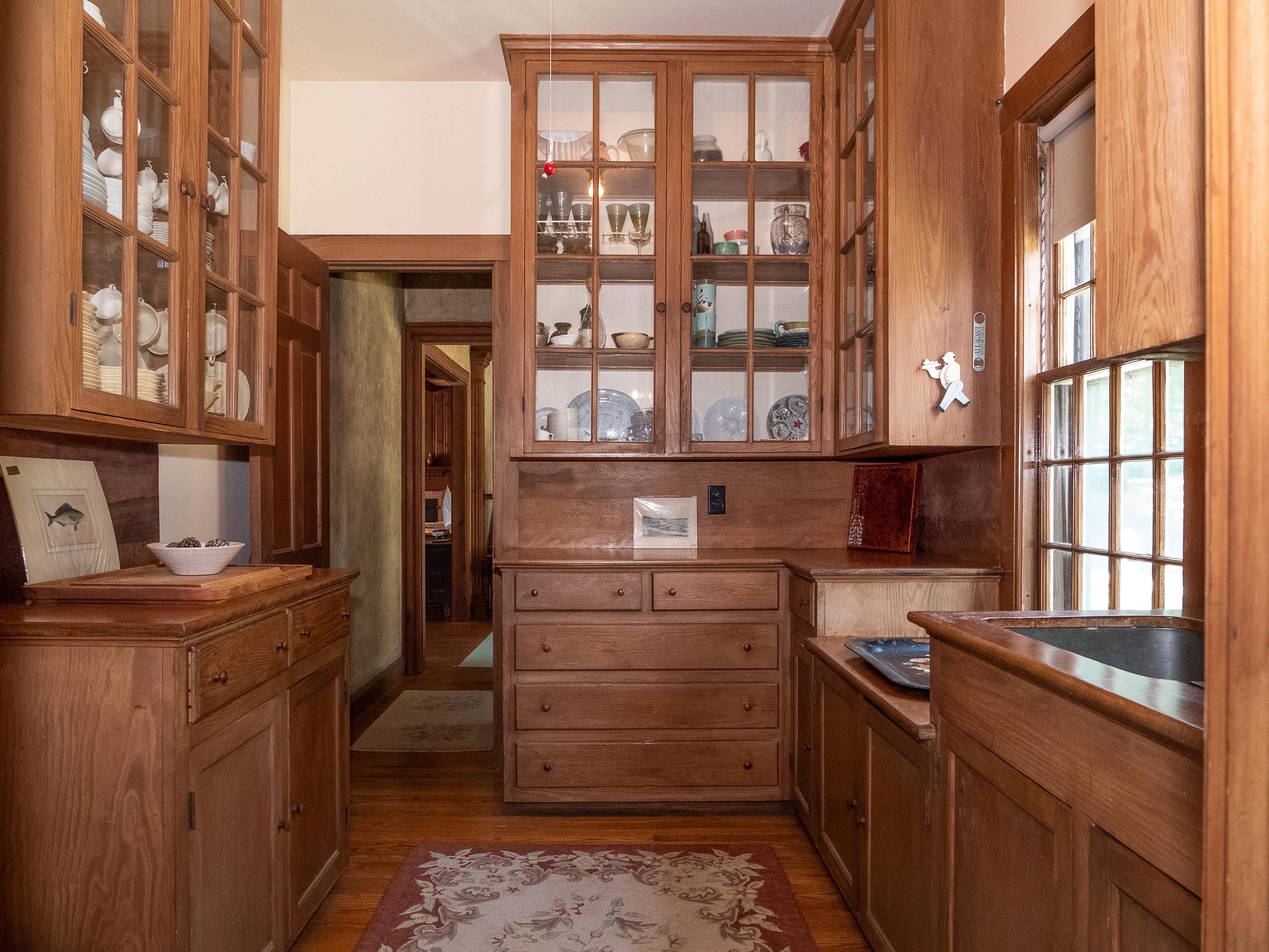 671 Old Post Road Cotuit, MA 02635 - Photo 14 of 36 a kitchen that has a lot of cabinets in it
