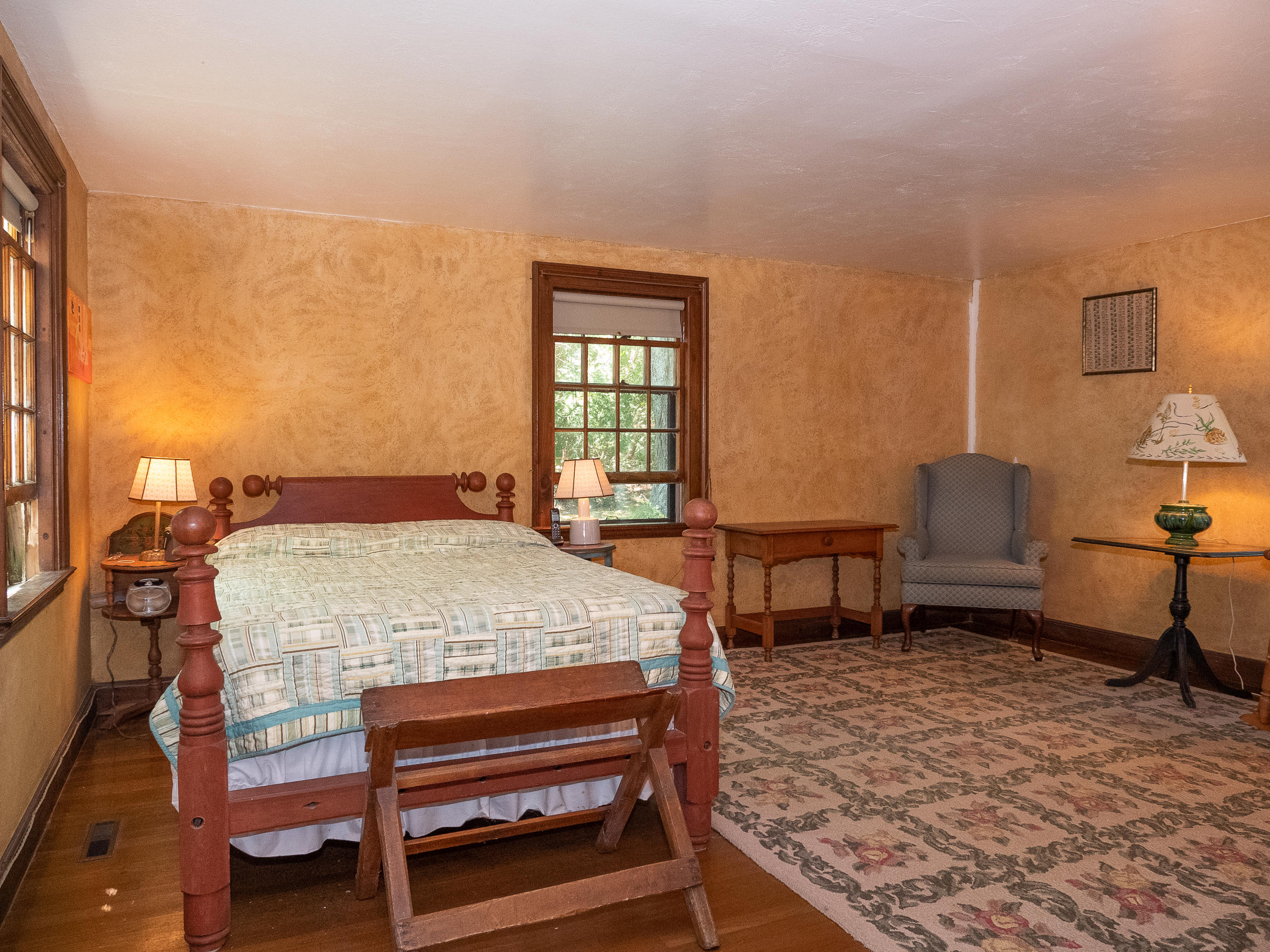 671 Old Post Road Cotuit, MA 02635 - Photo 19 of 36 a bedroom with a bed and wooden floor