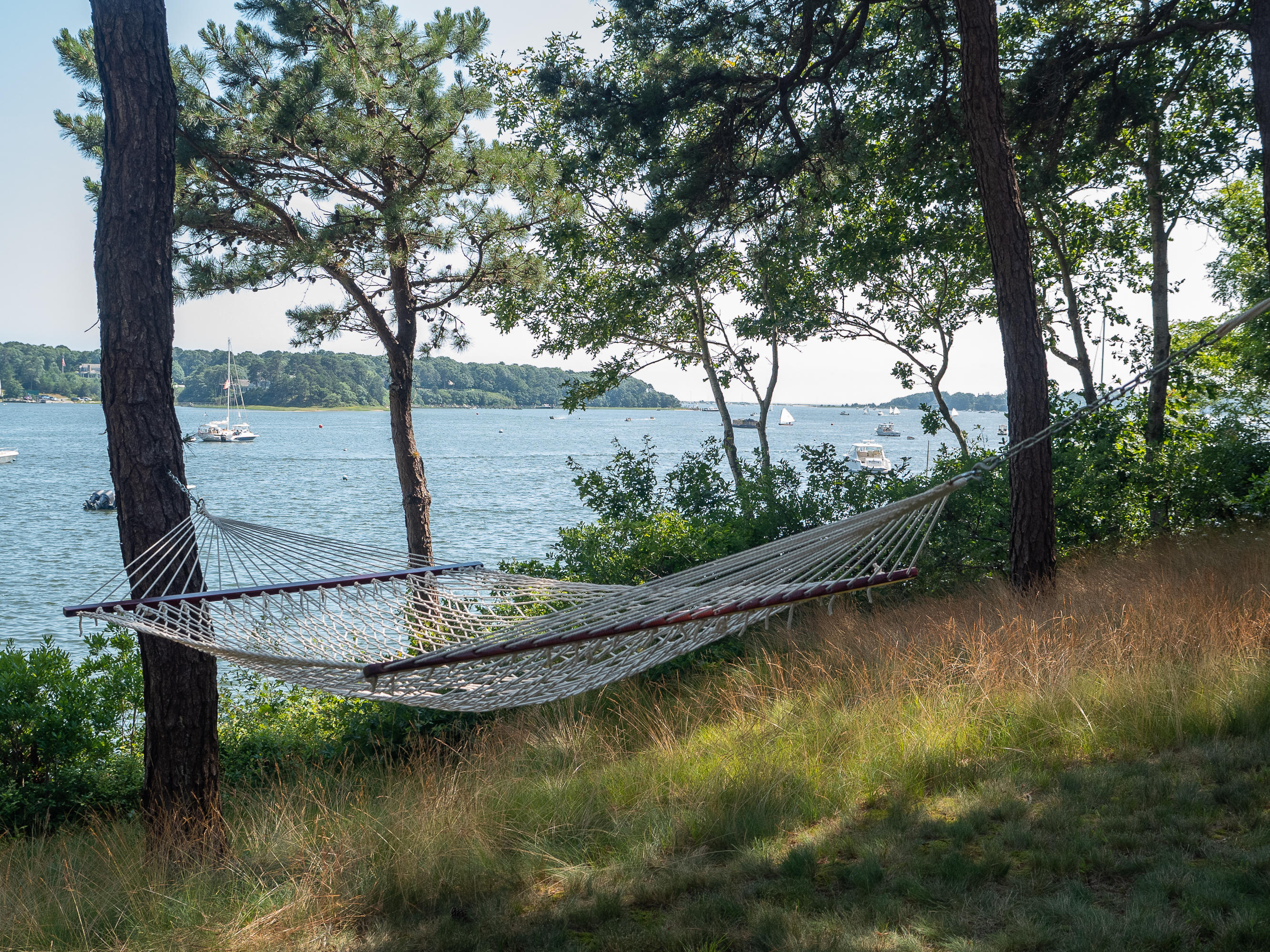 671 Old Post Road Cotuit, MA 02635 - Photo 25 of 36 a view of a lake with a tree