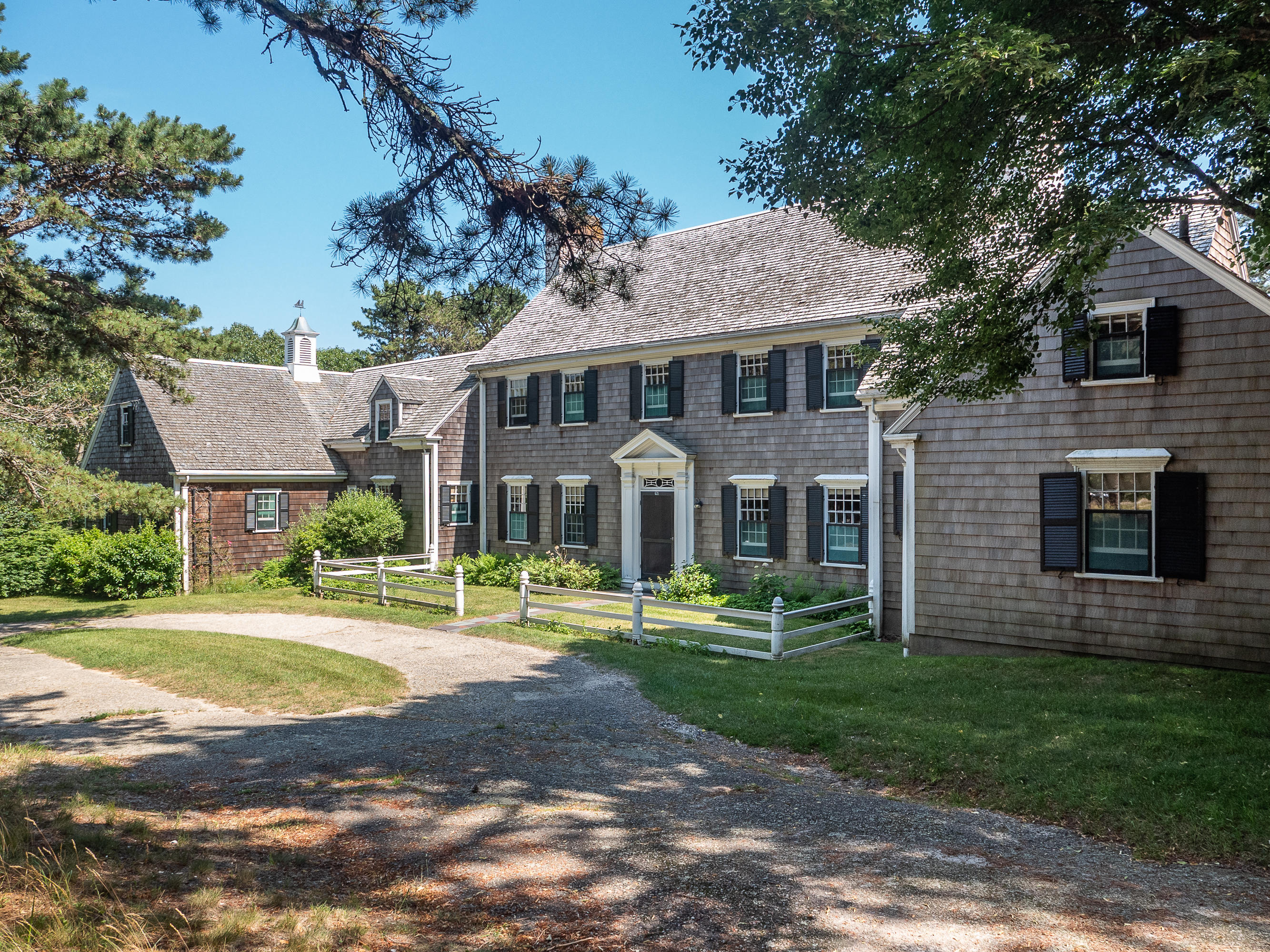 671 Old Post Road Cotuit, MA 02635 - Photo 32 of 36 a front view of a house with a yard