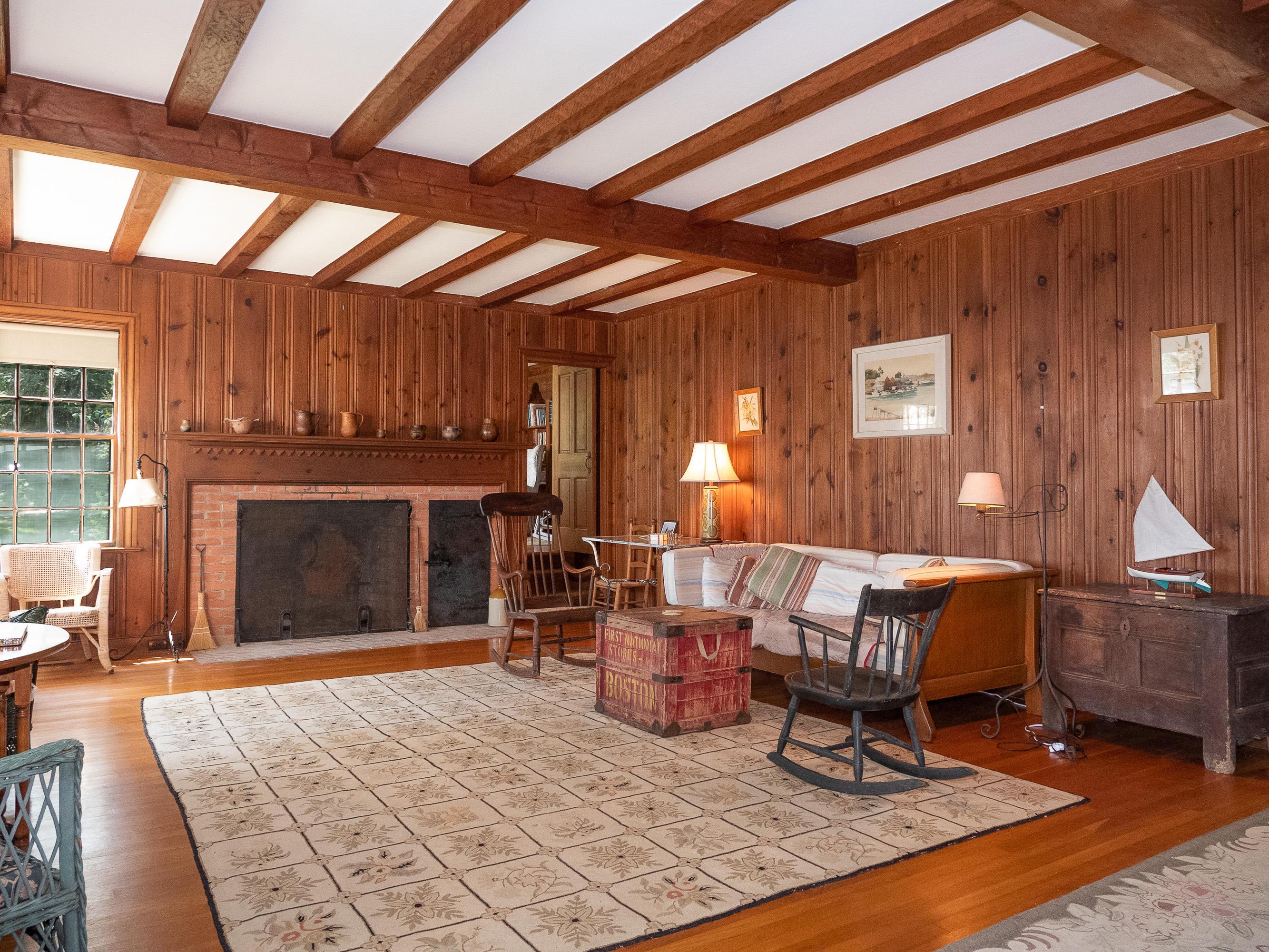 671 Old Post Road Cotuit, MA 02635 - Photo 9 of 36 a living room with furniture and a fireplace