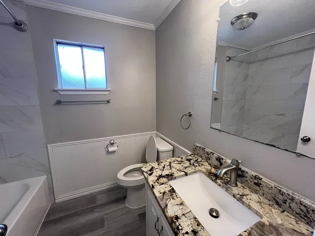 a bathroom with a sink and a toilet