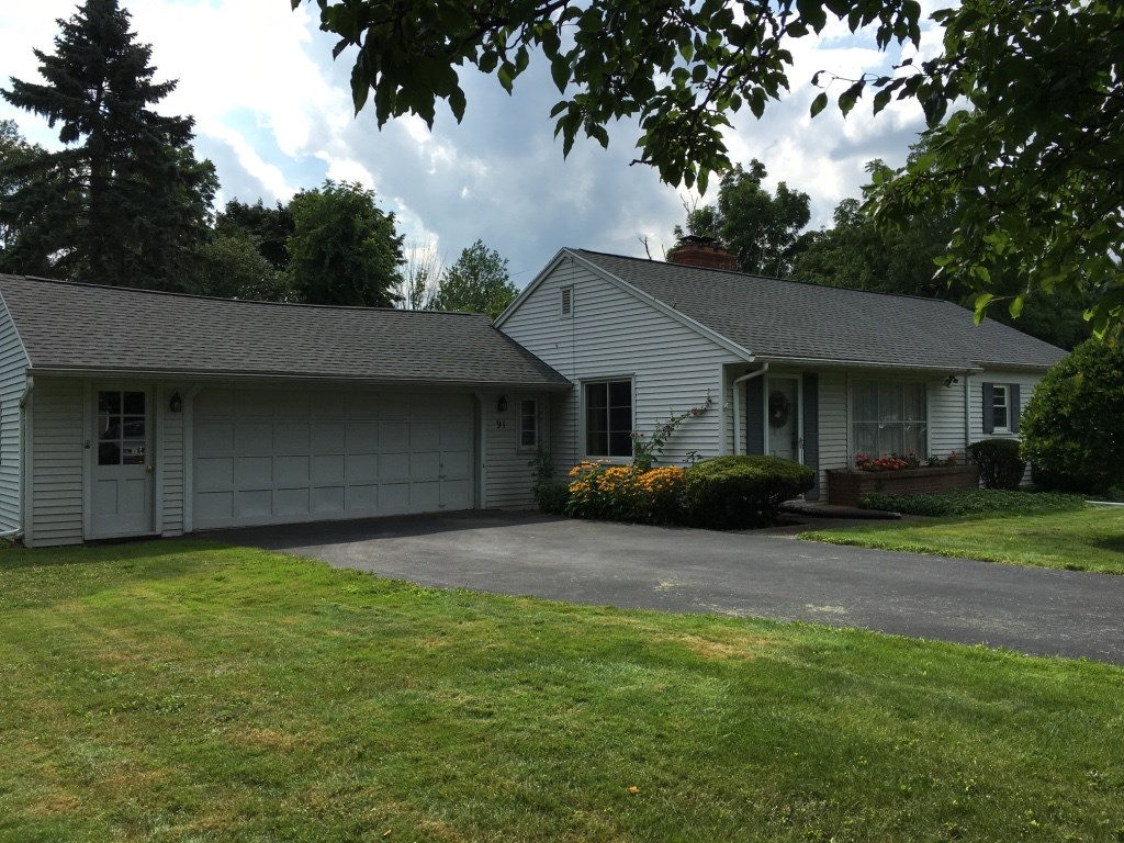 91 French Road Pittsford, NY 14618 - Photo 1 of 1 Front view of 91 French Road as approached from Ea