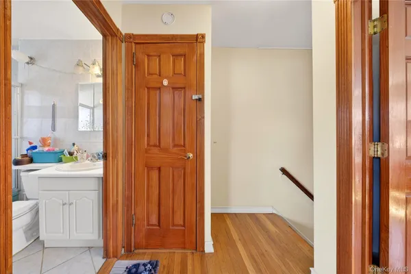 a view of a hallway with closet and front door